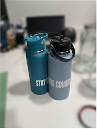 two water bottles with the words stay the course on them